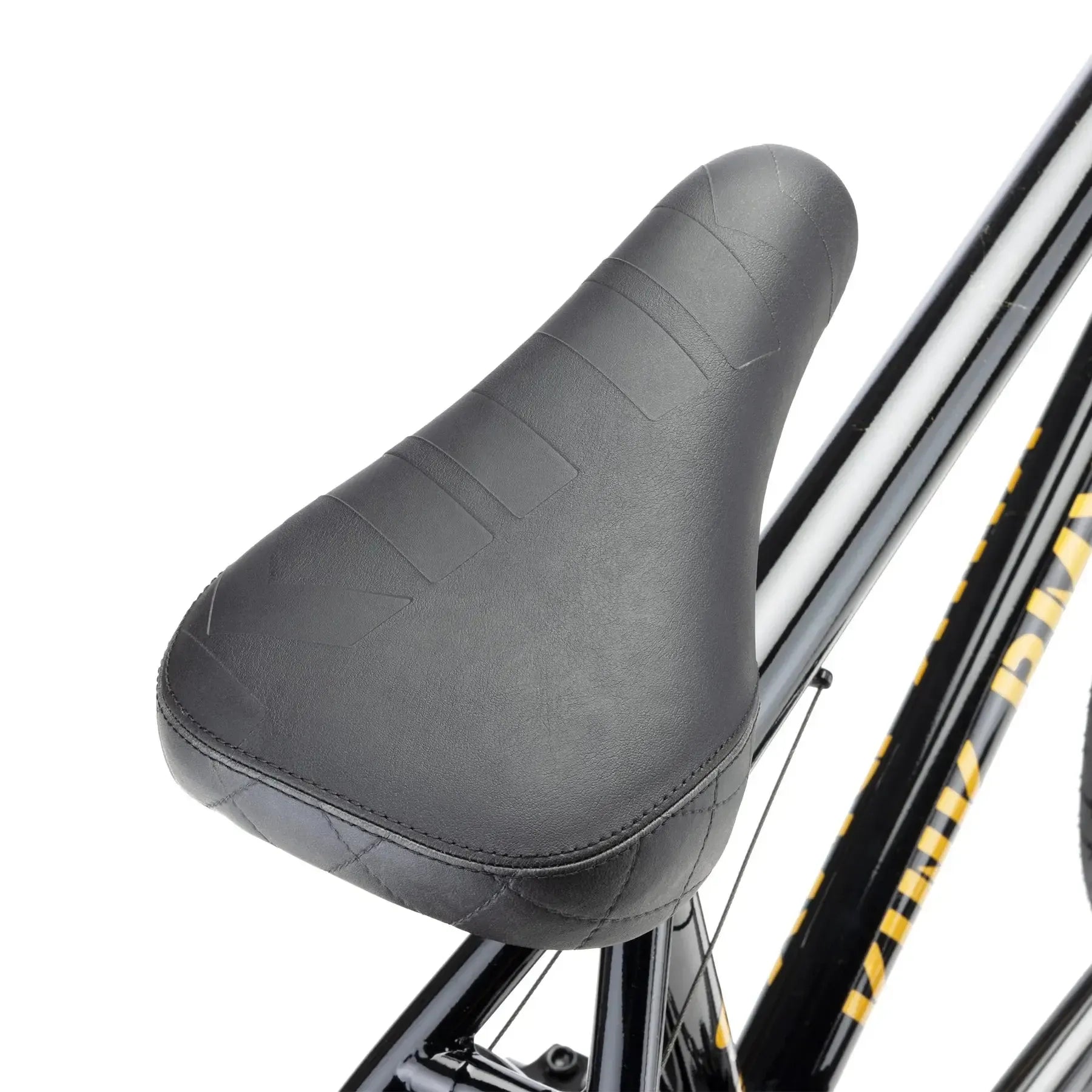 Close-up of a black bicycle seat attached to the Kink Gap XL 20 Inch Bike (2026), showcasing the seat’s textured surface, detailed stitching, and quality design typical of high-end BMX models.