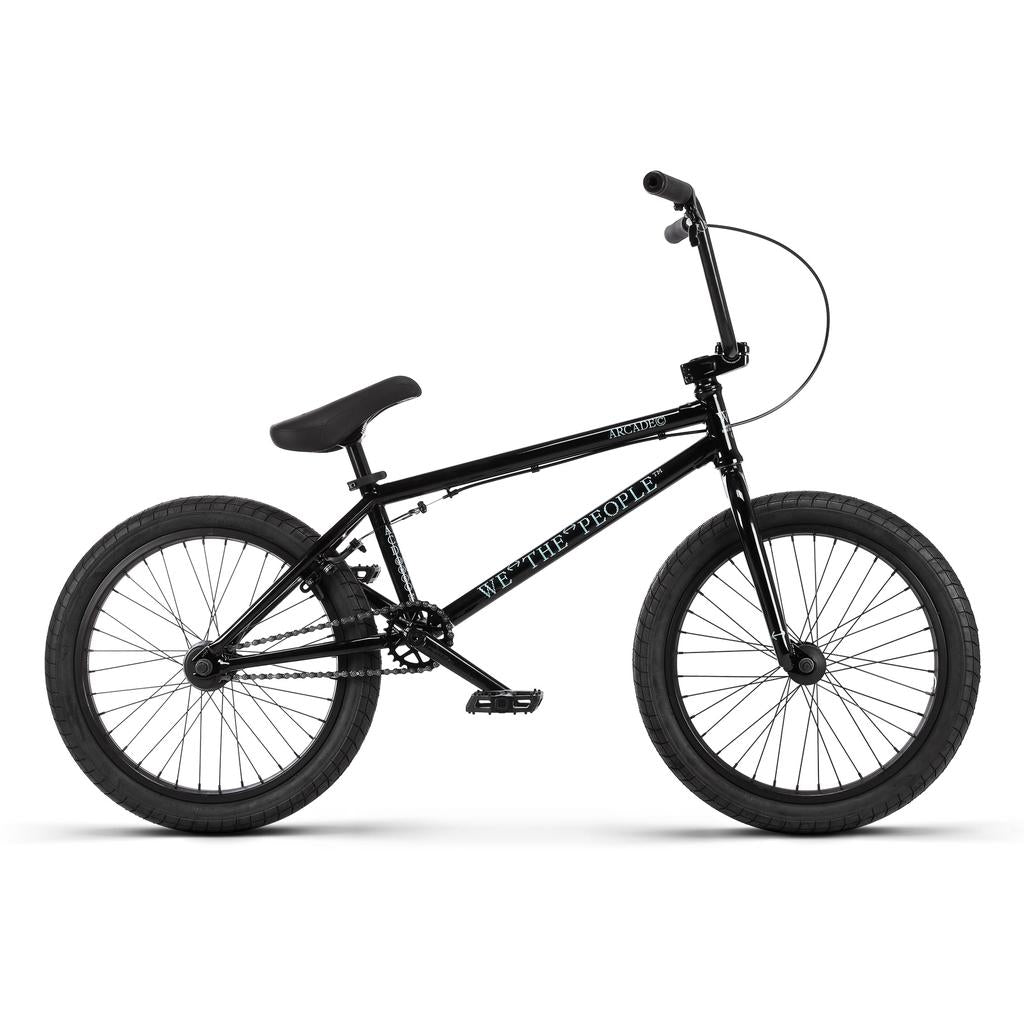 Black Wethepeople Arcade 20 Inch Bike with a single seat, black tires, and handlebars with a brake cable.