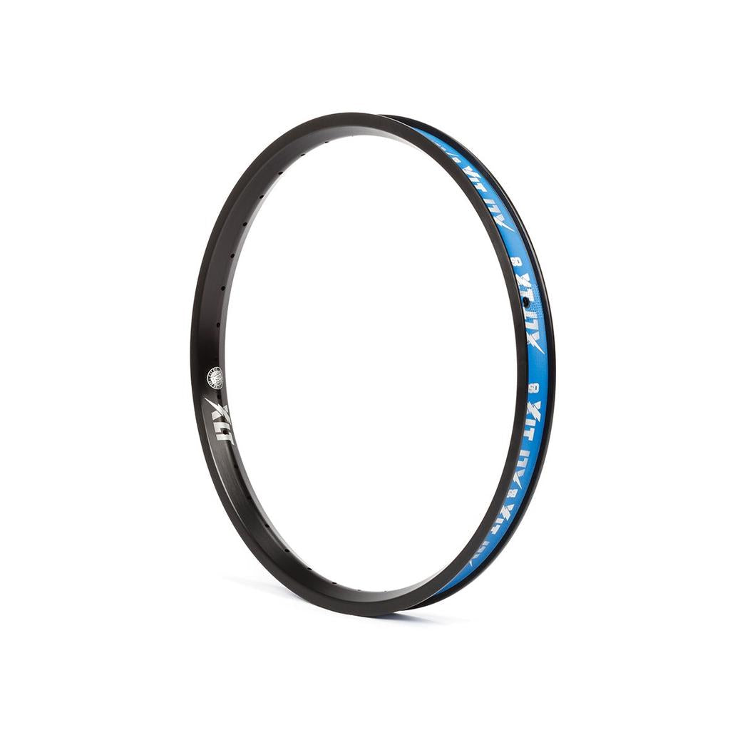 The BSD XLT Rim is a durable black bike rim with blue and white decals, displayed upright on a white background.