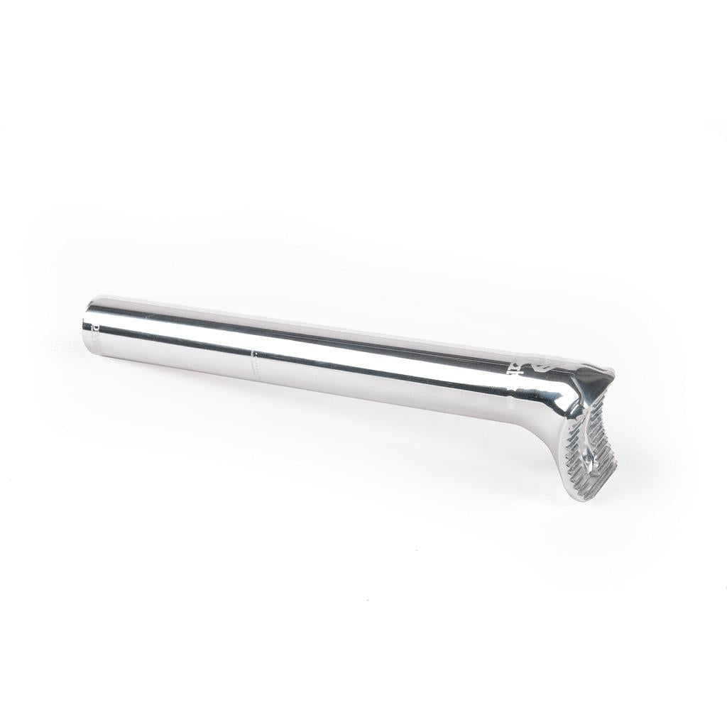 The Eclat Torch Seatpost is a silver metal, mid-length seat post featuring a textured clamp at one end, displayed on a white background.