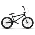 Wethepeople Arcade 20 Inch Bike: black mid-tier BMX shown in profile on a white background with "WE THE PEOPLE" on the frame. Features durable Salt Valon Rims. Note: final product appearance may vary.