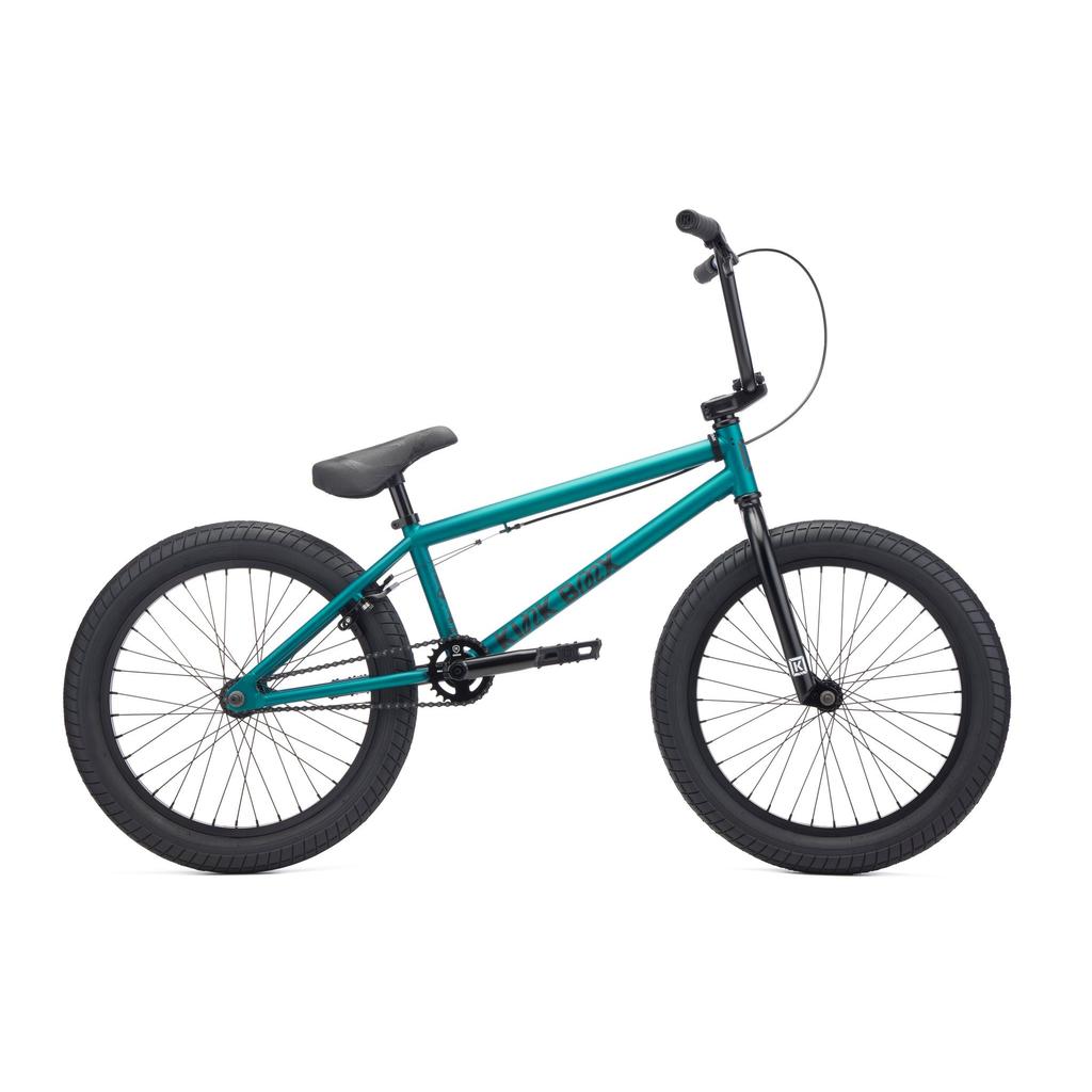 The Kink Curb 20 Inch Bike (2027) in teal features black seat, handlebars, pedals, and tires with premium Mission parts. Shown in profile against a white background, it’s ideal for beginners seeking a stylish BMX ride.