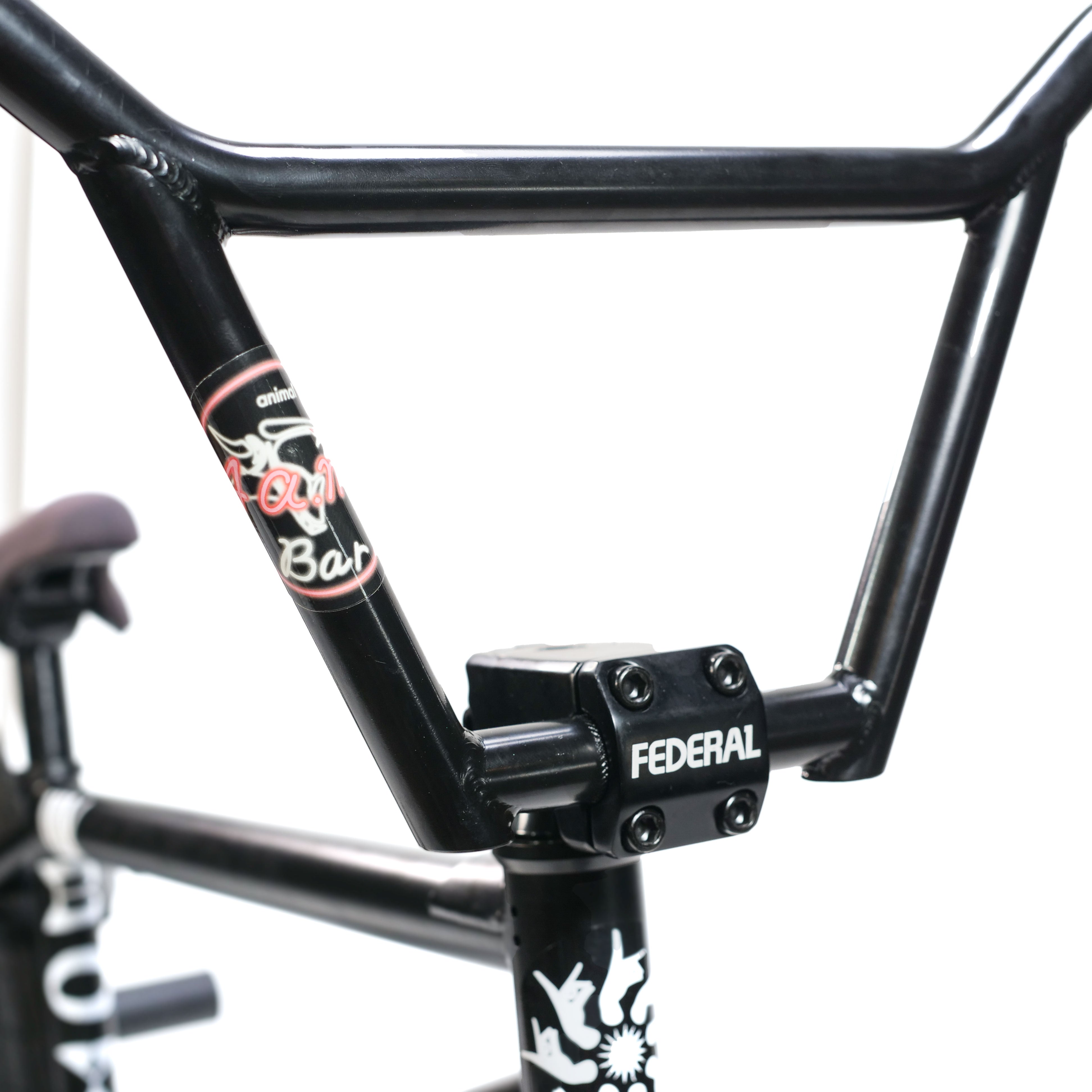 Close-up of a black handlebar with "Federal" stem and decals on the Federal Boyd x ION Custom 18 Inch Bike against a plain white background.