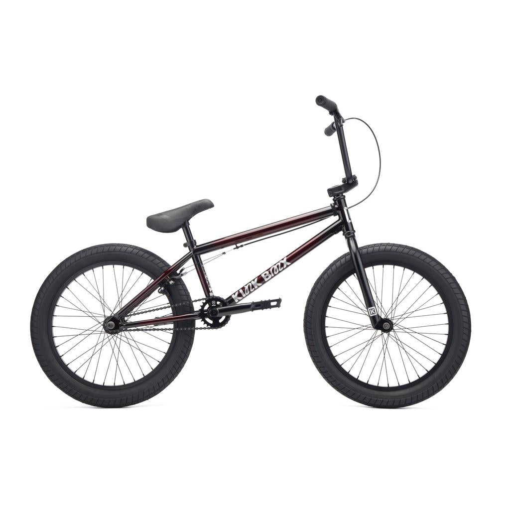 The Kink Curb 20 Inch Bike (2027) is shown in profile on a white background, featuring thick tires, a straight top tube, and a padded seat—making it an ideal beginner’s BMX bike.