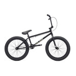 The Kink Curb 20 Inch Bike (2027) is a black beginner’s BMX with thick tires, straight top tube, Mission components, and a padded seat, pictured in profile on a white background.