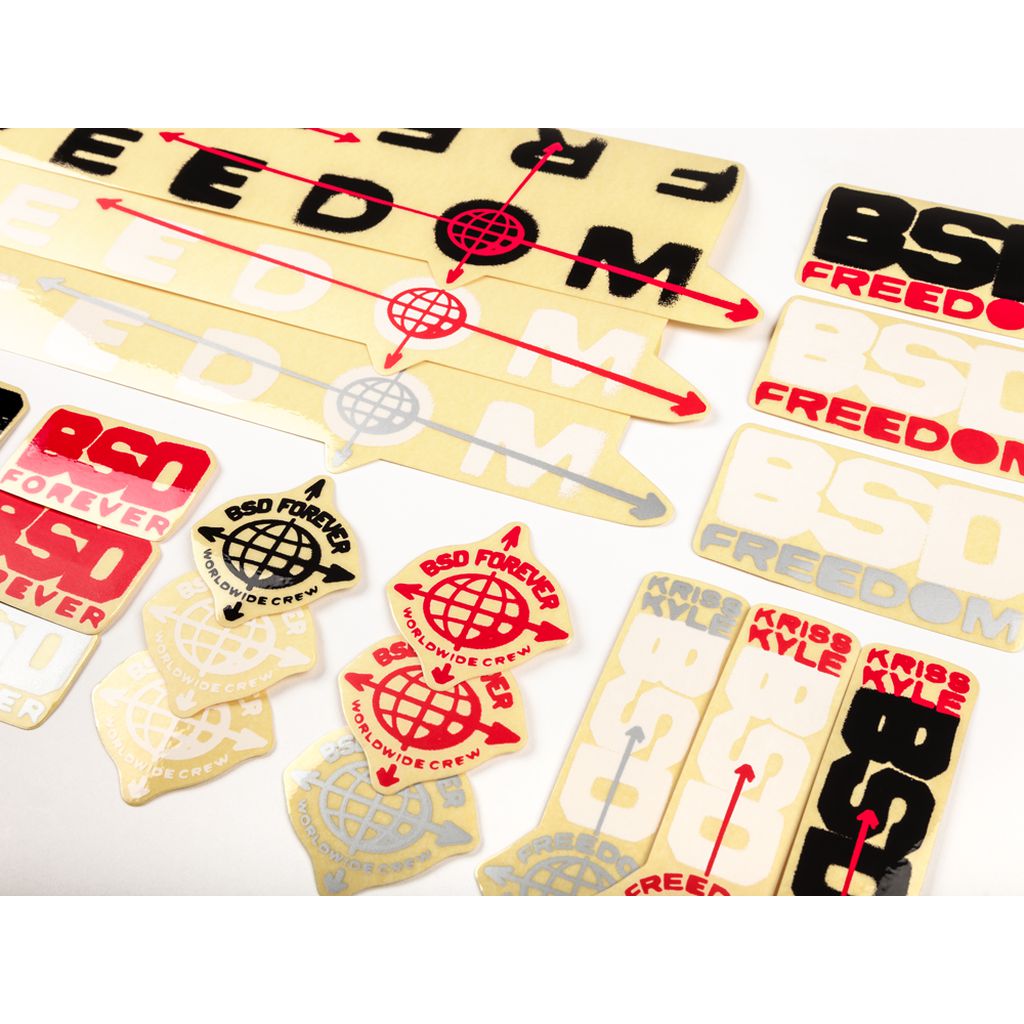 The BSD Freedom Frame 2019 Decal Set includes a variety of stickers showcasing different BSD Freedom and BSD Forever designs in multiple fonts and styles, featuring globe motifs and arrows, all arranged on a white background.