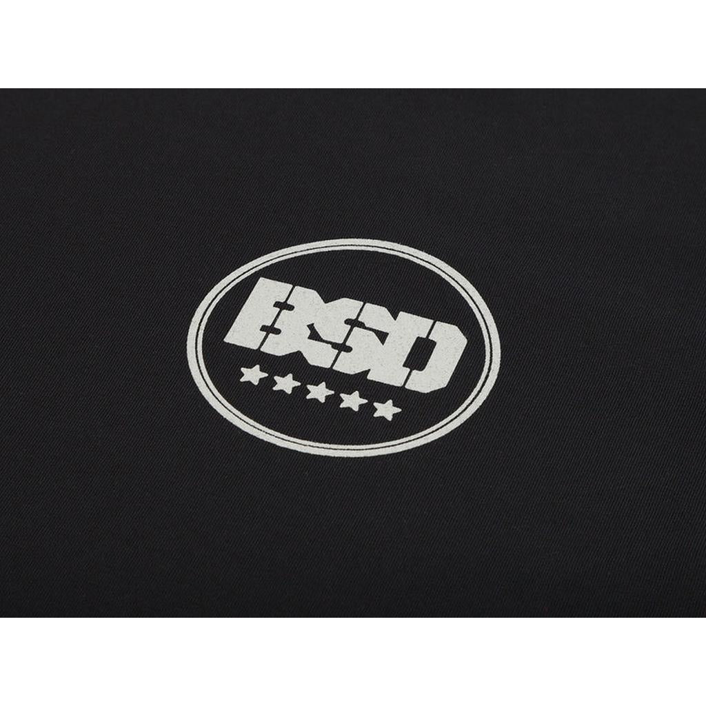 The "BSD" encircled graphic with four stars beneath, set against a dark background on the Fully Roasted T-Shirt, captures the bold energy reminiscent of a double shot coffee.