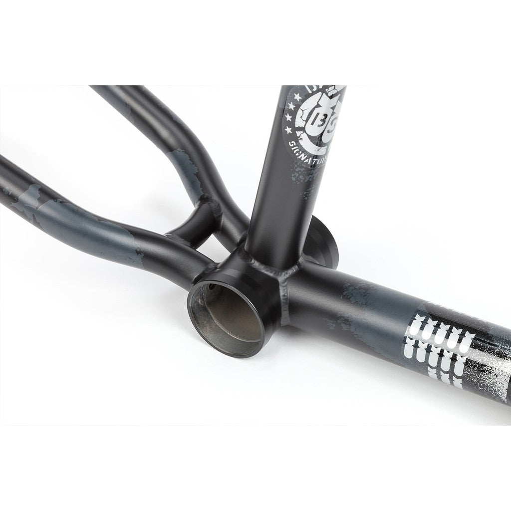 Black BSD Soulja V3 Frame BMX bike frame with white detailing and branding, showing wear and scratches, isolated on a white background.