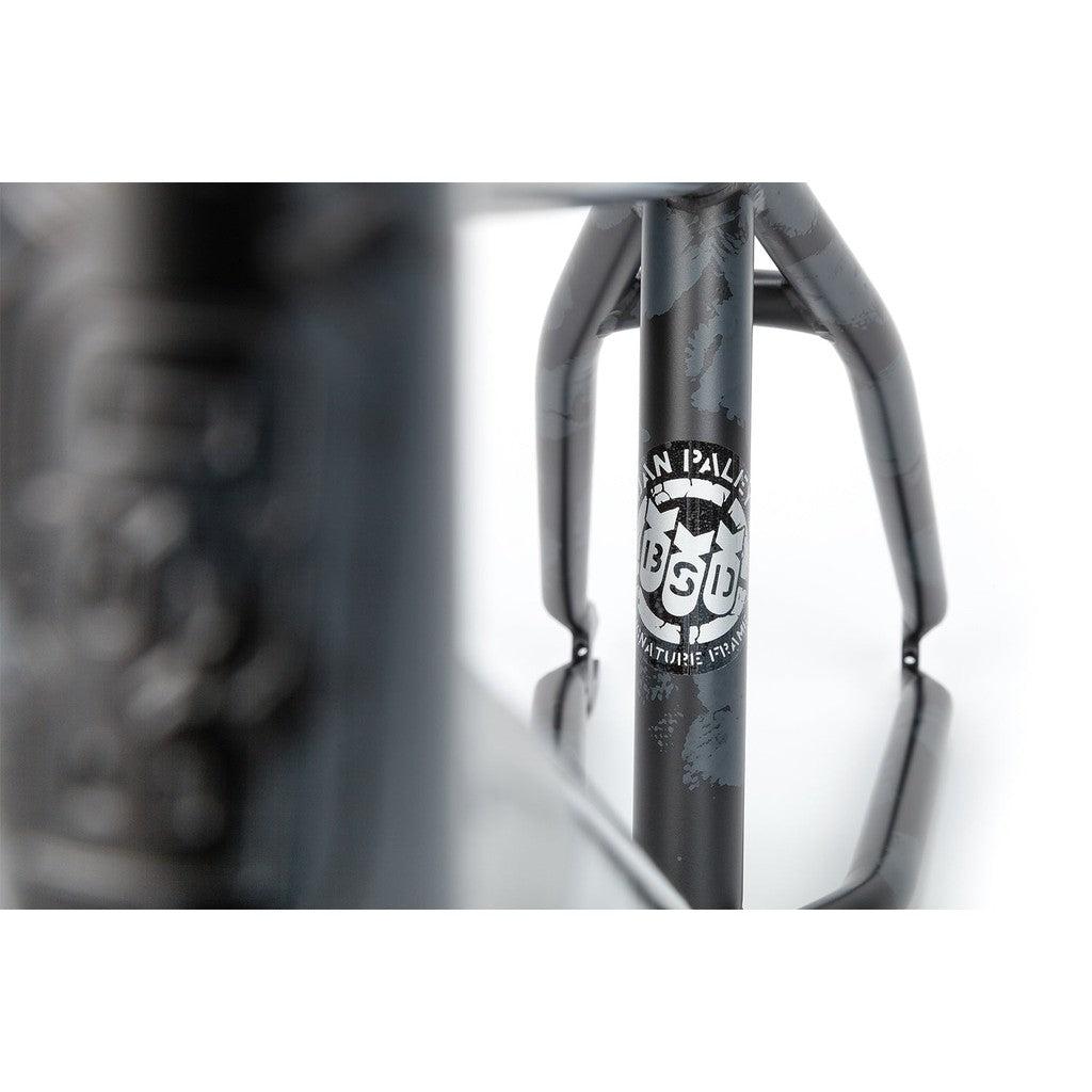 Close-up of a BSD Soulja V3 Frame with a decal reading "Iron Palm 360 Attitude RPM" on a white background, featuring invest cast dropouts.