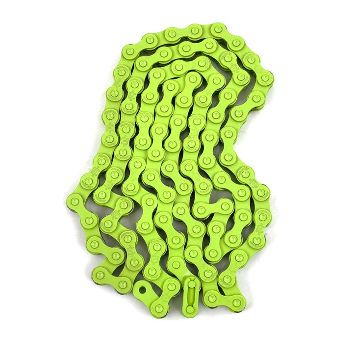 A lime green Mission 510 single speed BMX chain coiled on a white background.