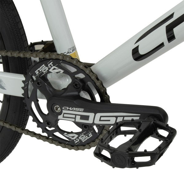 A close up of a Chase Edge Pro L Bike (2024) with a chain and chainring.