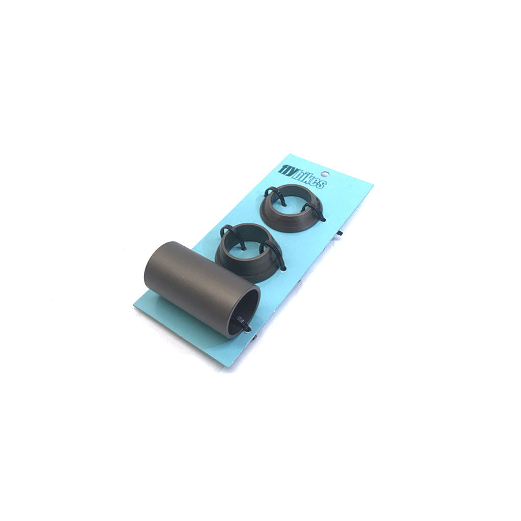 A blue package with a cylindrical object and two circular clips, similar to replacement Fly 22mm Spanish BB Spacers Only, set against a white background.