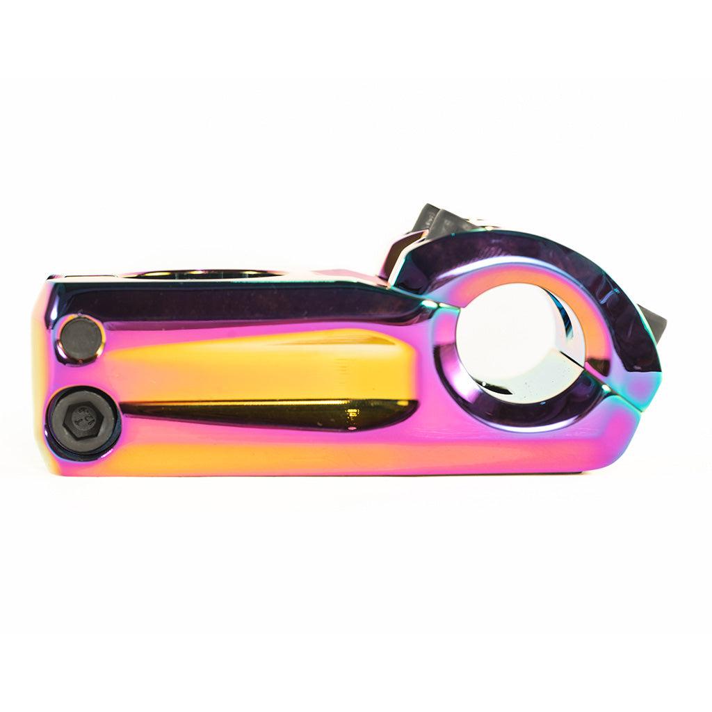 A rainbow colored bike pedal with a Colony Variant 52mm BMX Stem.