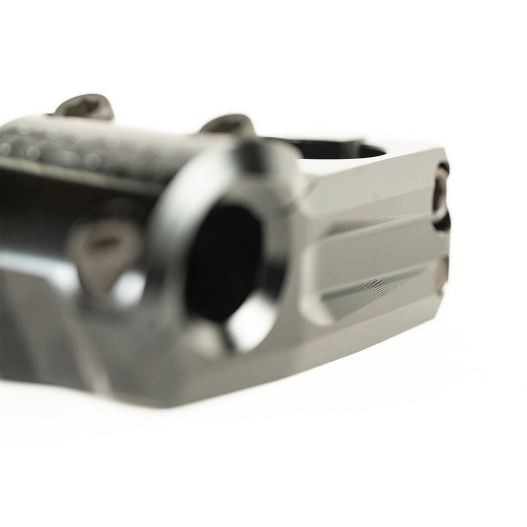 A close up image of a Colony Variant 52mm BMX stem featuring a gun barrel-like design.