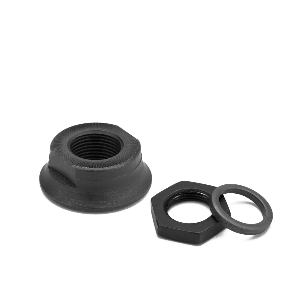 A pair of black Mission Engage Cassette Hub Cones, including a hex nut and a washer for freestyle BMX.