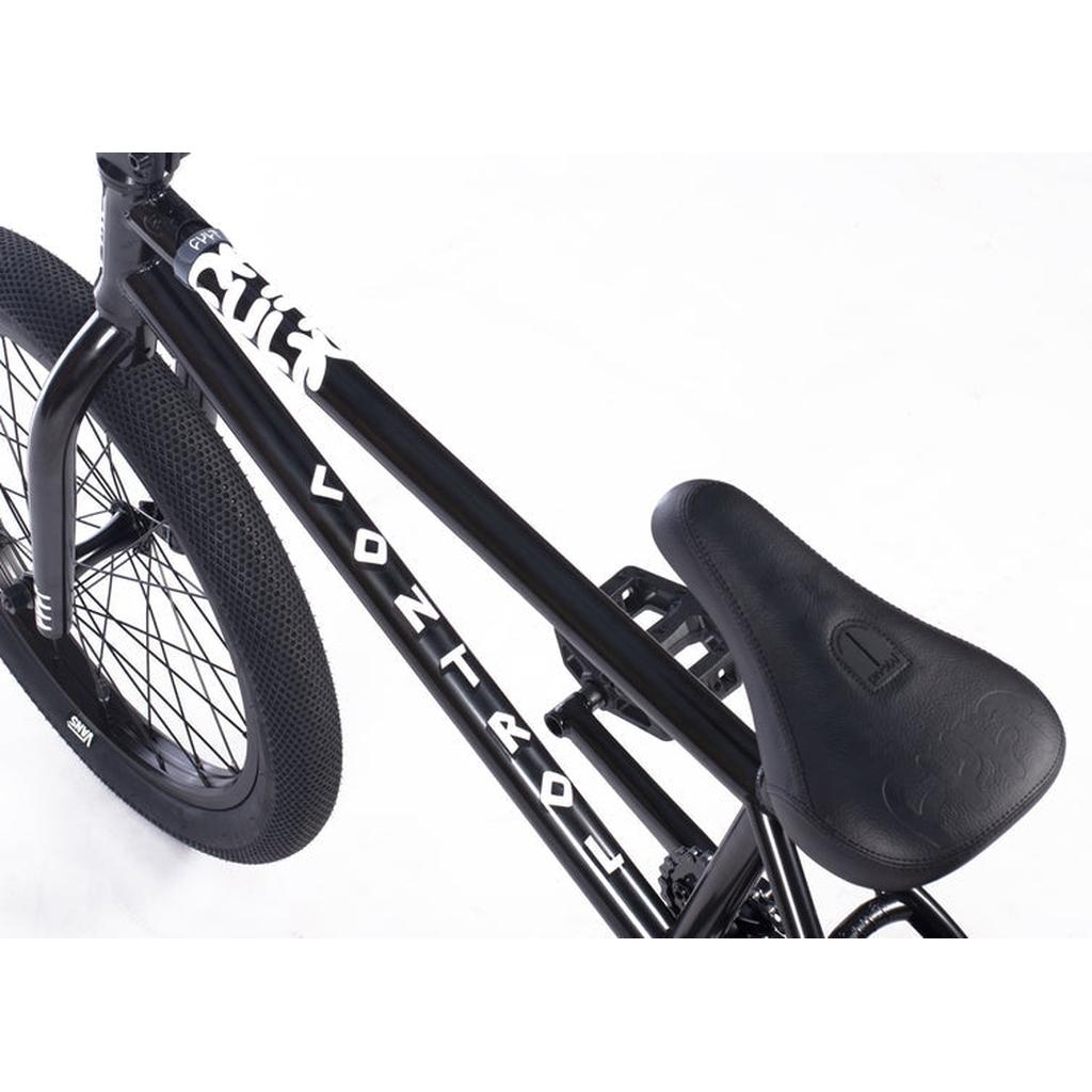 Close-up view of a Cult Control 20 Inch Bike in black, highlighting the seat, rear wheel, and chromoly frame with "VONTR4OL" printed on the top tube.