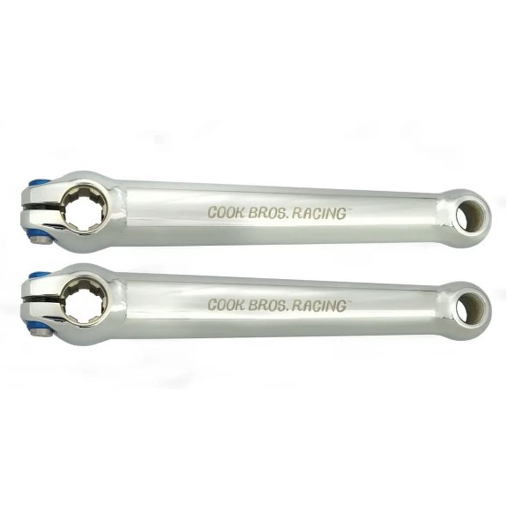 Two Cook Bros Racing Crank Set silver metal bicycle crank arms with "COOK BROS. RACING" engraved on them, laid side by side against a white background.