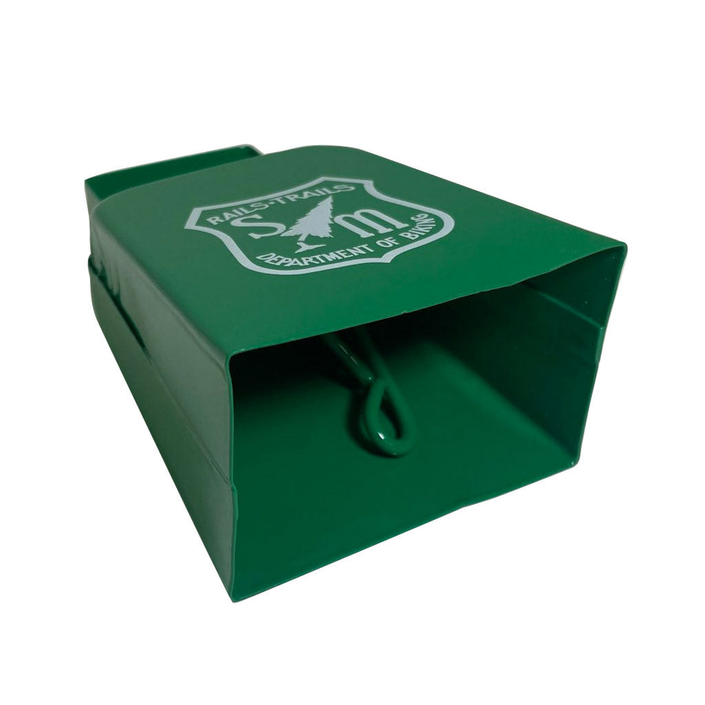 A green box with a logo of the S&M Cowbell on it.