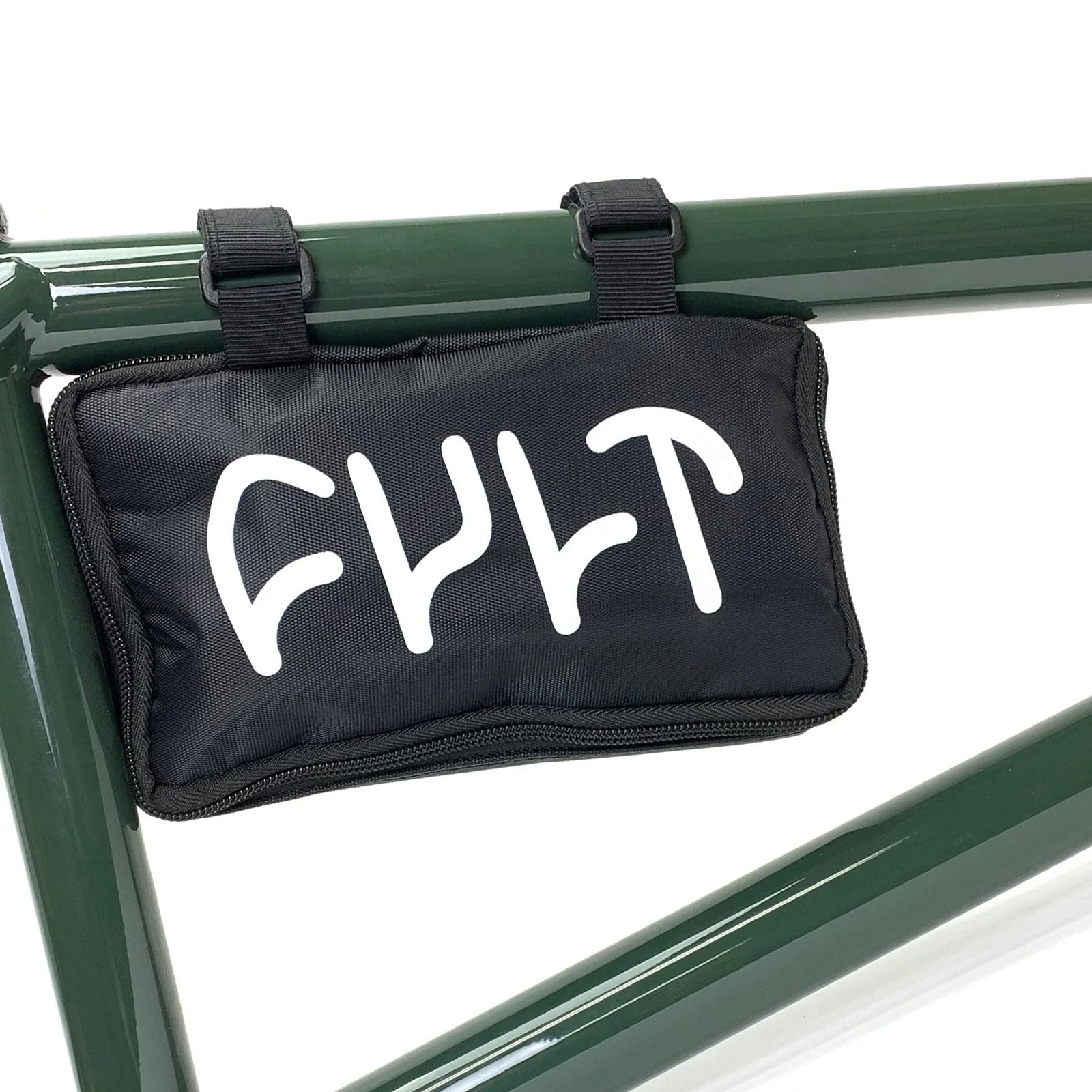 A black zippered pouch labeled "CULT" is attached to a dark green bike with two straps, ideal for carrying the Cult Deluxe Tool & Pump Kit—perfect for transporting bike repair tools or your BMX tool kit on the go.