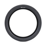 The Cult Fast And Loose Folding Tyre, a black, round bicycle tire with minimal tread, is shown upright against a white background, designed for low rolling resistance and optimal speed.