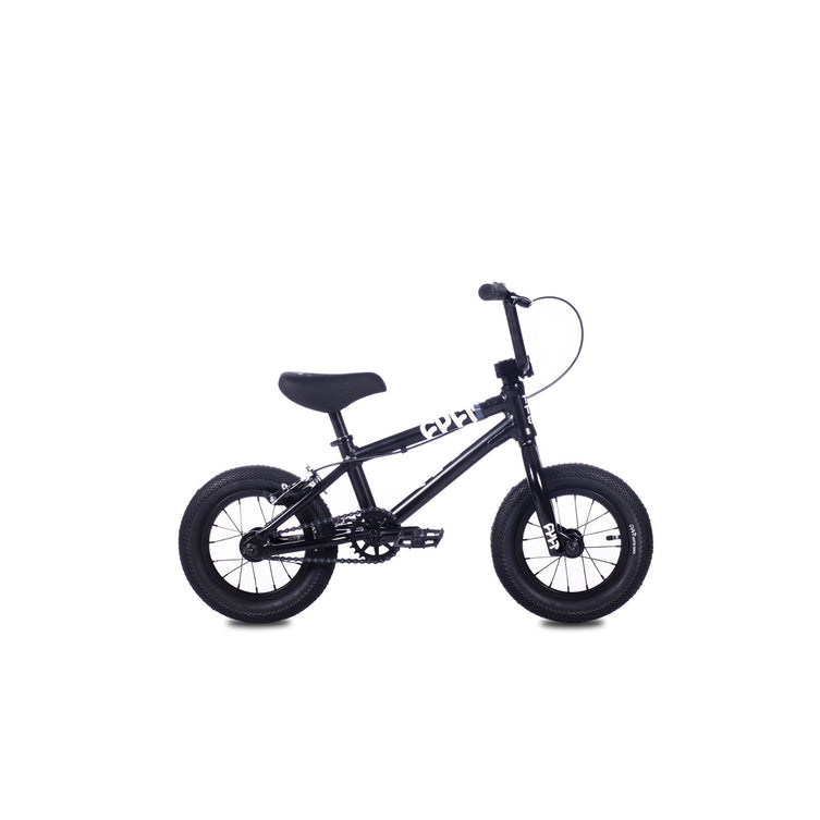 The Cult Juvi 12 Inch Bike, a small black kids BMX with thick tires, padded seat, straight handlebars, and an aluminium frame, is shown against a white background.