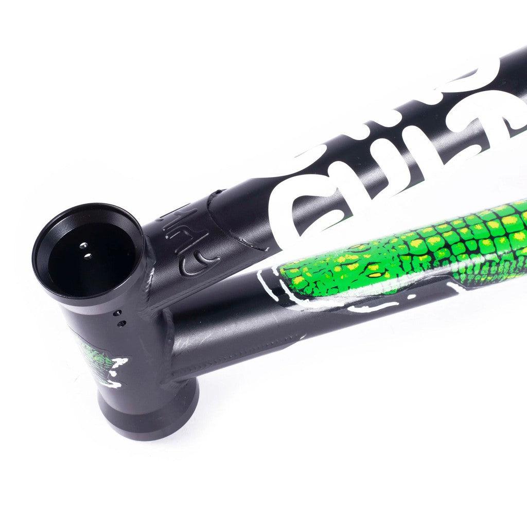 A black and green Cult Trey Jones frame with a snake on it.
