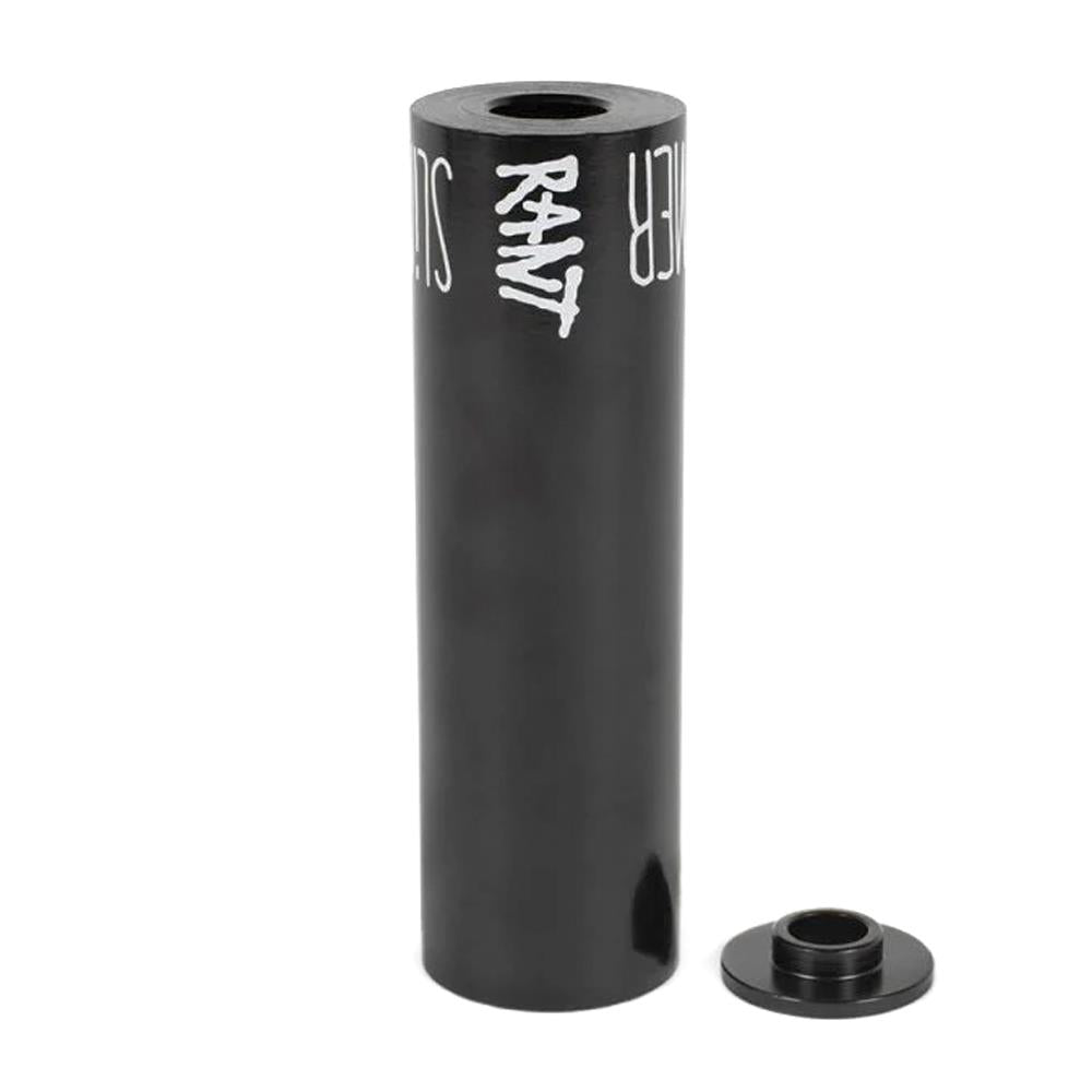 The Rant Slimmer Peg (Each) is a black cylindrical BMX peg featuring "RANT" branding, displayed upright beside a metal spacer—ideal for riders wanting a durable yet lightweight bike peg.