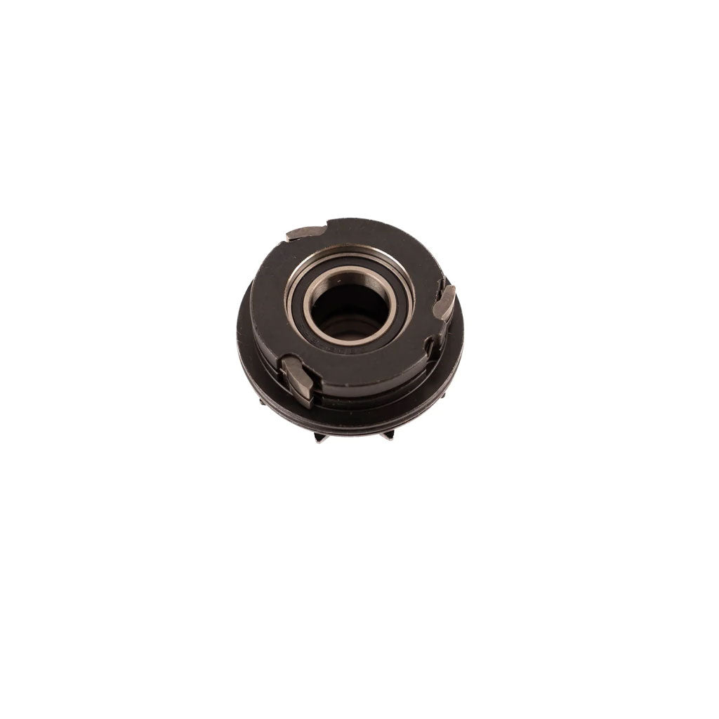 A Fit Drive Unit / KMX97R with a central hole, four small protrusions on the side, and a metal finish, often used in sealed bearing hubs for enhanced durability and performance.