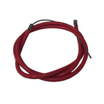 A red hose with a black DRS OEM Slick Brake Cable attached to it.