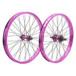 The DRS Expert Wheelset features two BMX wheels with metallic pink double wall rims and black spokes, standing upright side by side against a white background.