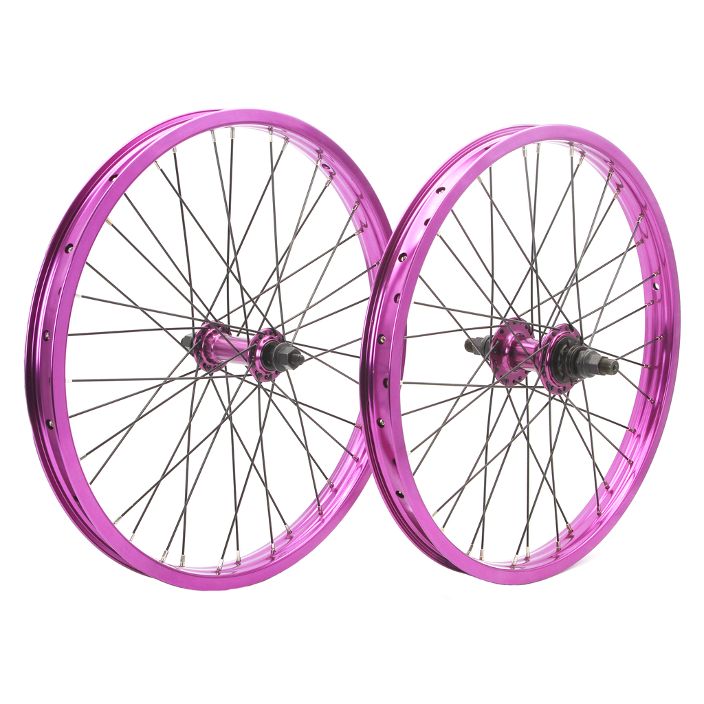 The DRS Expert Wheelset features two BMX wheels with metallic pink double wall rims and black spokes, standing upright side by side against a white background.