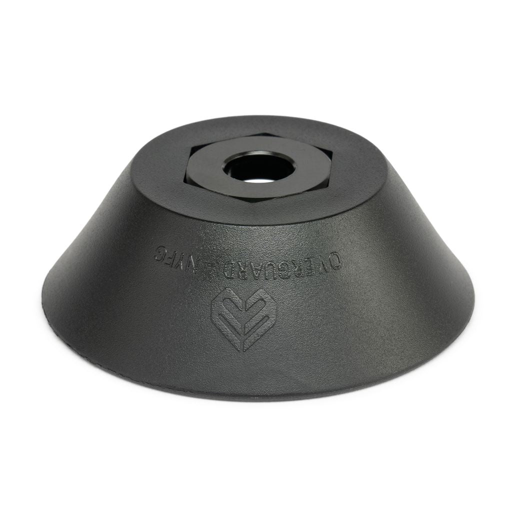 The Eclat Overguard Front Nylon Universal Hub Guard features a black metal base with a central cylindrical hole and engraved text "OLLOCLAMP WMS" accompanied by a logo on the surface. It is designed for a universal fit and includes an anti-rotation system.