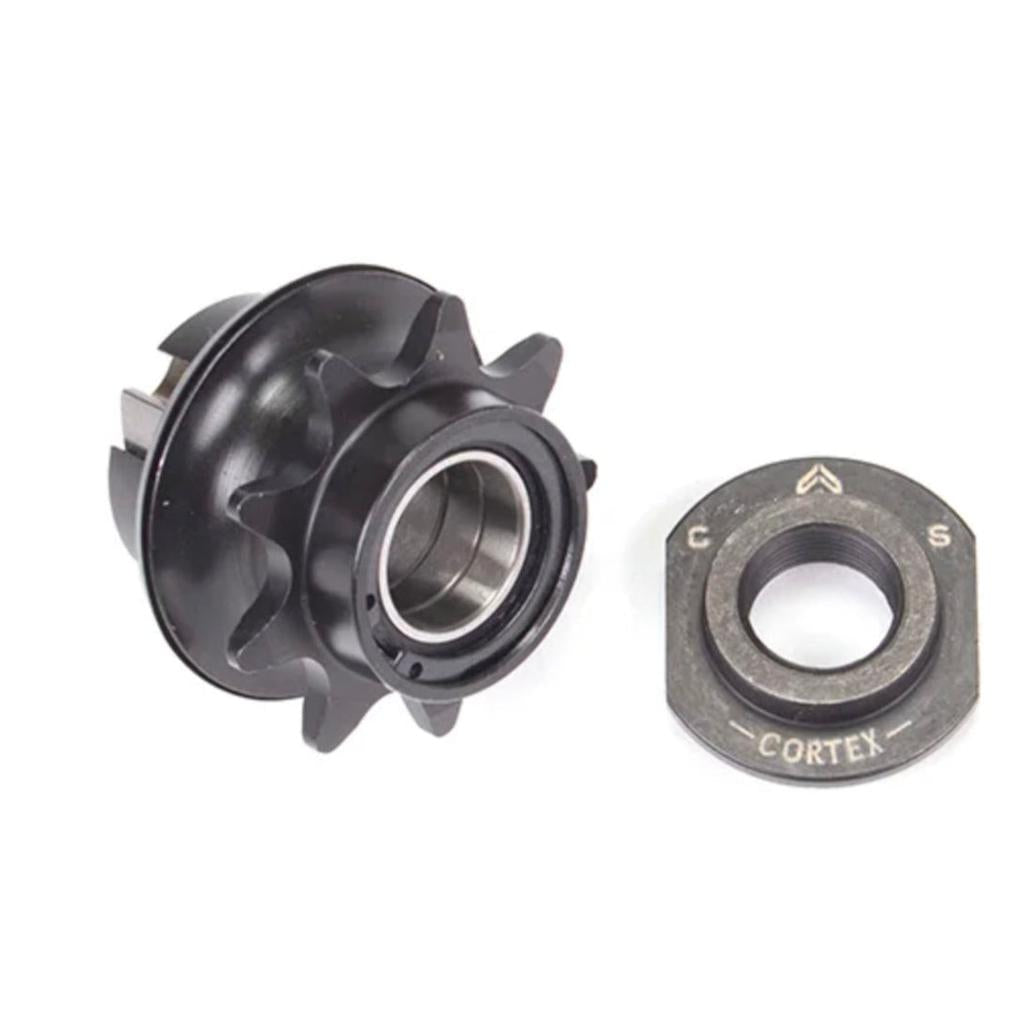 A black metal Eclat Cortex CS (Cassette) Hub Driver with a sprocket and circular lockring is shown on a white background.