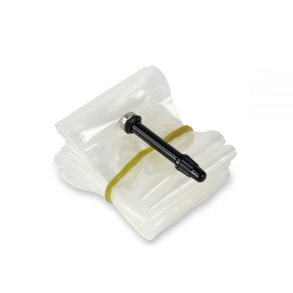 The EXCESS Ultra Light 20 X 1.1/8-3/8 Tube (40mm PV) is a coiled, transparent, flexible thermoplastic polyurethane strip featuring a black valve in the center secured with a rubber band.