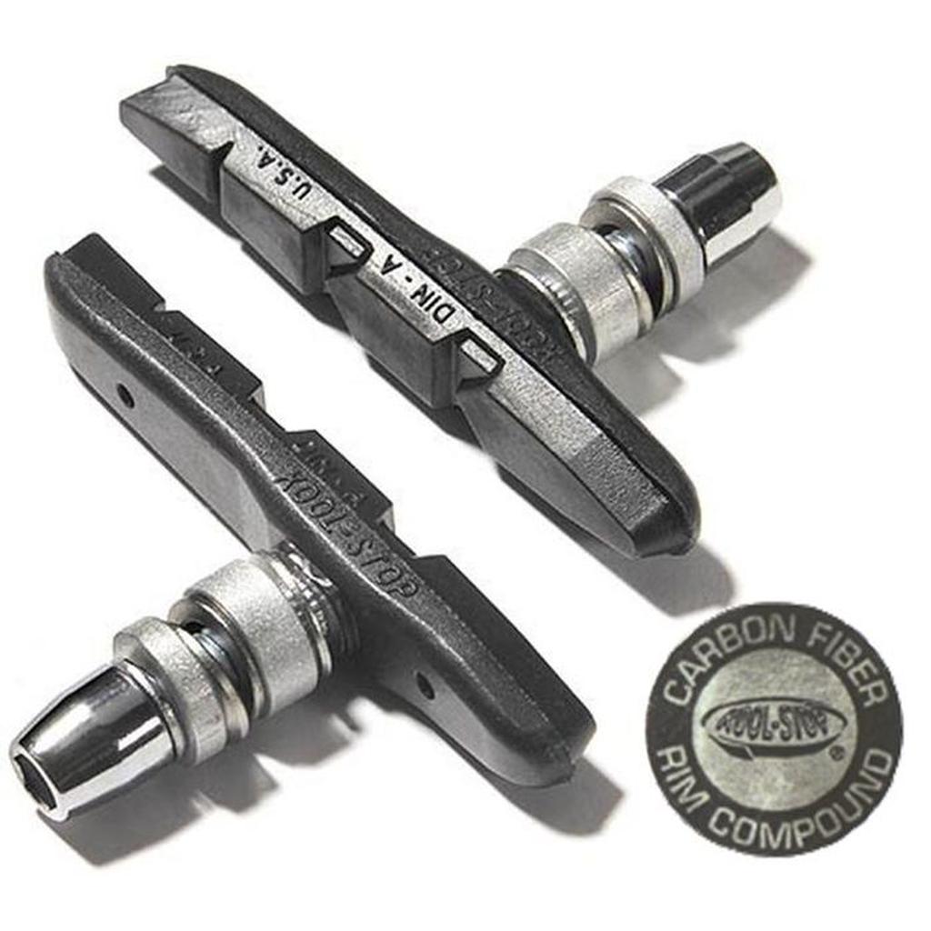 Two black Kool Stop Thinline Brake Pads For Carbon Fibre Rim with metal bolts are shown beside a "Carbon Fiber Rim Compound" label, designed for optimal braking performance on carbon fibre rim surfaces.