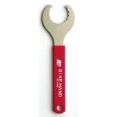 The Bottom Bracket Wrench is a metal tool with a red handle labeled "Bike Hand" and features a semicircular, toothed opening at one end.