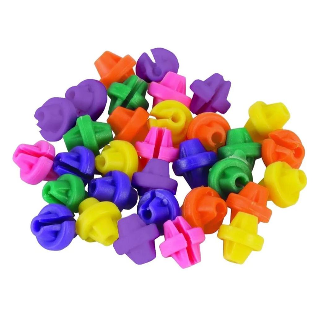 Spokie Dokies (36 Pack) features brightly colored plastic nozzles scattered across a white background in vibrant shades of purple, green, pink, yellow, orange, and blue, reminiscent of fun spoke attachments.