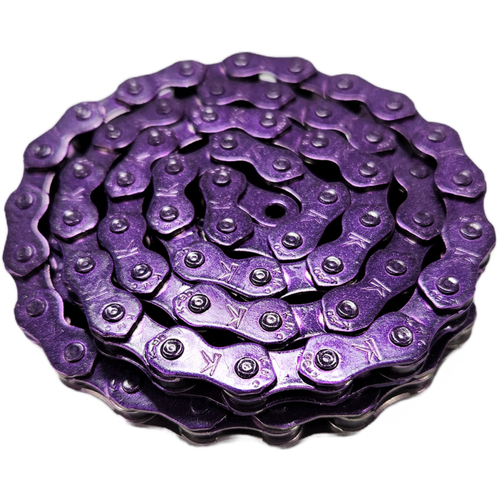 A coiled KMC K1 Chain (Wide) / 112L in metallic purple, displayed against a white background.