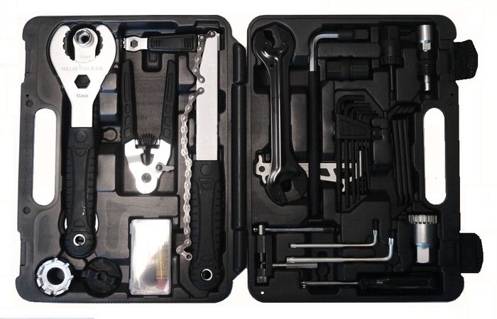 The Bike Repair Tool Kit - 21 Piece Set features a black plastic case that opens to reveal wrenches, pliers, Allen keys, and more bike repair tools, all neatly organized in molded slots.
