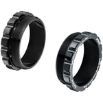 Two black T47 to BB86 Bottom Bracket Conversion Cups feature external and internal threading. Displayed upright and angled, their ridged sides and smooth interiors are visible.