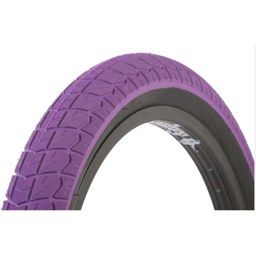 A close-up of the Duro 20 Inch Tyre, featuring a purple tread and black sidewall, mounted on a bike rim—ideal for riders seeking affordable tyres with stylish design.
