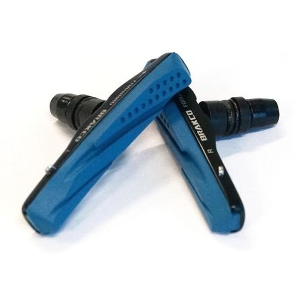 Two Cartridge Brake Pads For Carbon Rims in blue and black with alloy holders are crossed on a white surface.