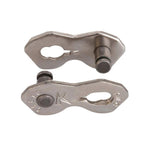 Two KMC K1SL metallic narrow bicycle chain connecting links with oval holes and locking pins, shown against a white background.