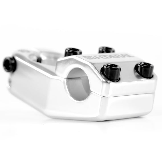 Close-up of the Federal Element V2 Top Load Stem made from silver aluminum with black bolts, designed for connecting handlebars to the bike fork for optimal reach.