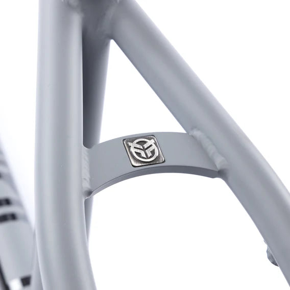 Close-up of a Federal Bruno ICS2 Frame in gray 4130 Chromoly, featuring a small silver geometric logo emblem on the frame bracing.