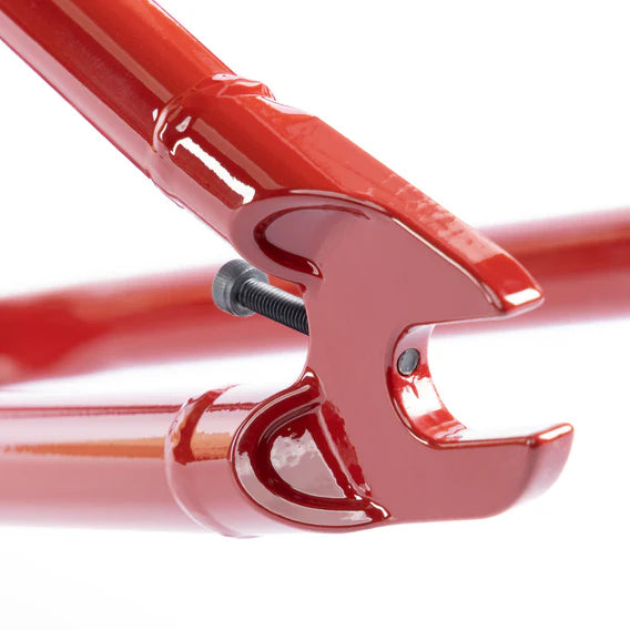 Close-up of the Federal Team ICS2 Frame's red rear dropout, featuring a tension adjustment screw and made from durable 4130 Chromoly tubing for technical street riding.