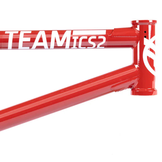 Close-up of the Federal Team ICS2 Frame in red, crafted from 4130 Chromoly tubing with striking white "TEAM ICS2" lettering along the top tube.