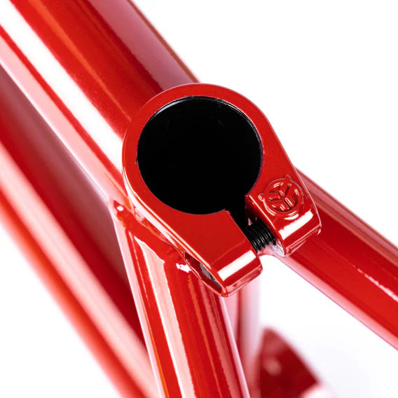 Close-up of the Federal Team ICS2 Frame in red, highlighting the seat clamp area with a visible hex bolt and embossed logo, crafted from robust 4130 Chromoly tubing.