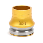 A gold and silver cylindrical object with the word "FIEND" on it, likely a Fiend Headset, featuring precision sealed cartridge bearings for optimal performance.