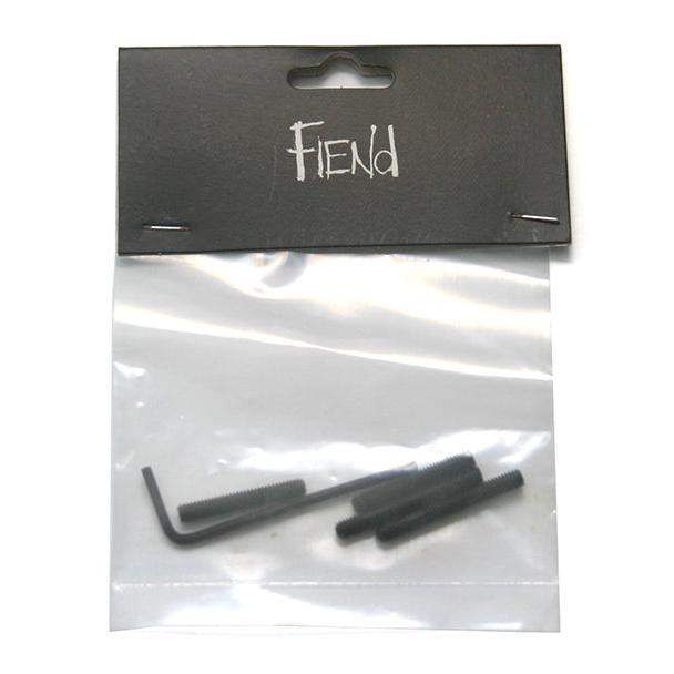A clear plastic bag containing two replacement bolts and an L-shaped hex key, with a black cardboard label that reads "Fiend Frame Chain Tensioner Kit.